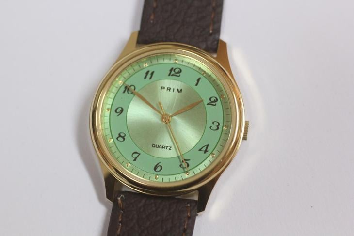 Pánské hodinky PRIM Quartz, zelený číselník, nenošené