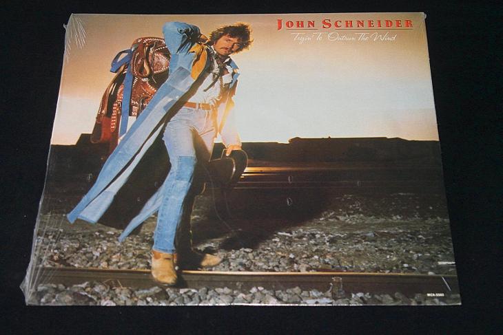 LP - John Schneider ‎- Tryin' To Outrun The Wind   (d23) - Hudba
