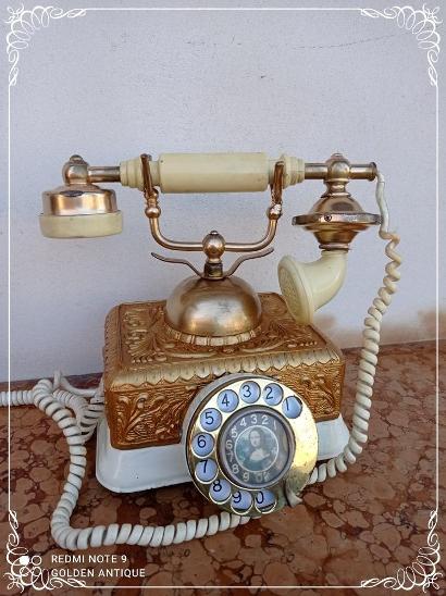Starožitný kovový dekorativní vytáčecí telefon