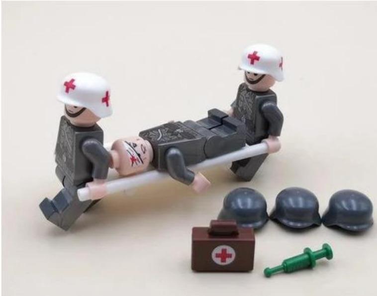 zdravotníci s raneným vojakom + nosidlá a výbava - Deti