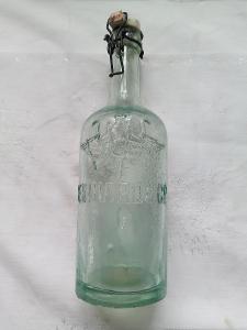 Historická lahev s orlicí a porcelánovým uzávěrem - REINHARD & Co