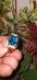 Krásný prsten s velkým modrým topazem a čirými zirkony. Nenošený.Vel66 - Šperky