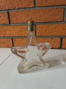 Skleněná stará lahev ve tvaru hvězdy