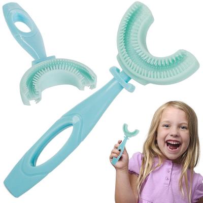 Silikonový zubní kartáček pro děti ve tvaru U..