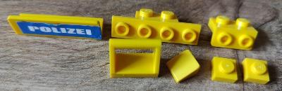 LEGO - bracket, hladké dieliky 1x1, 1x4, s nálepkou POLIZEI - žlté