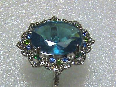 Krásný prsten s různobarevnými Spinely, čiré Zirkony. Nenošený. Vel.63