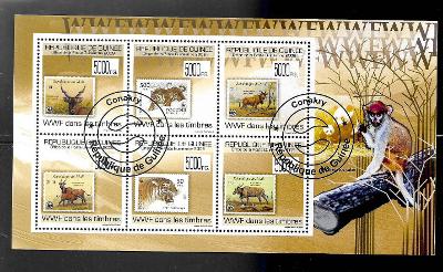 GUINEA - známka na známce - antilopy, tygři, kočkodan husarský